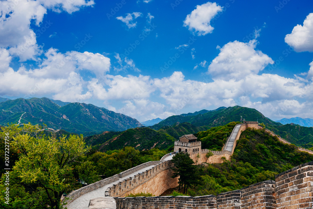 Fototapeta premium Great wall stretching along mountainous ridge under blue sky in Beijing China