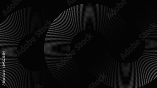 An elegant abstract dark background featuring continuous metallic silver concentric circles and flowing wave lines.