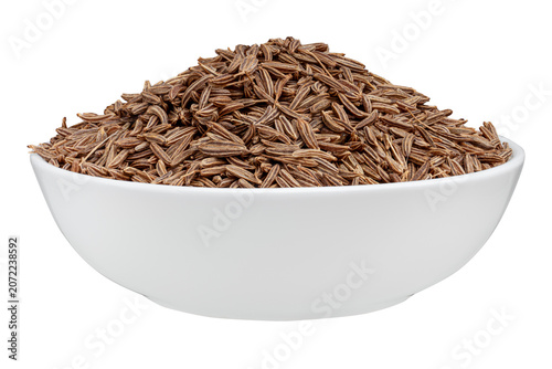 фотографія Caraway seeds in bowl isolated on white background