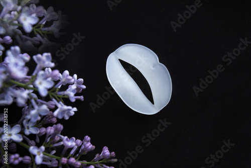 Foto on a black background, a silicone appliance for restoring children's bite