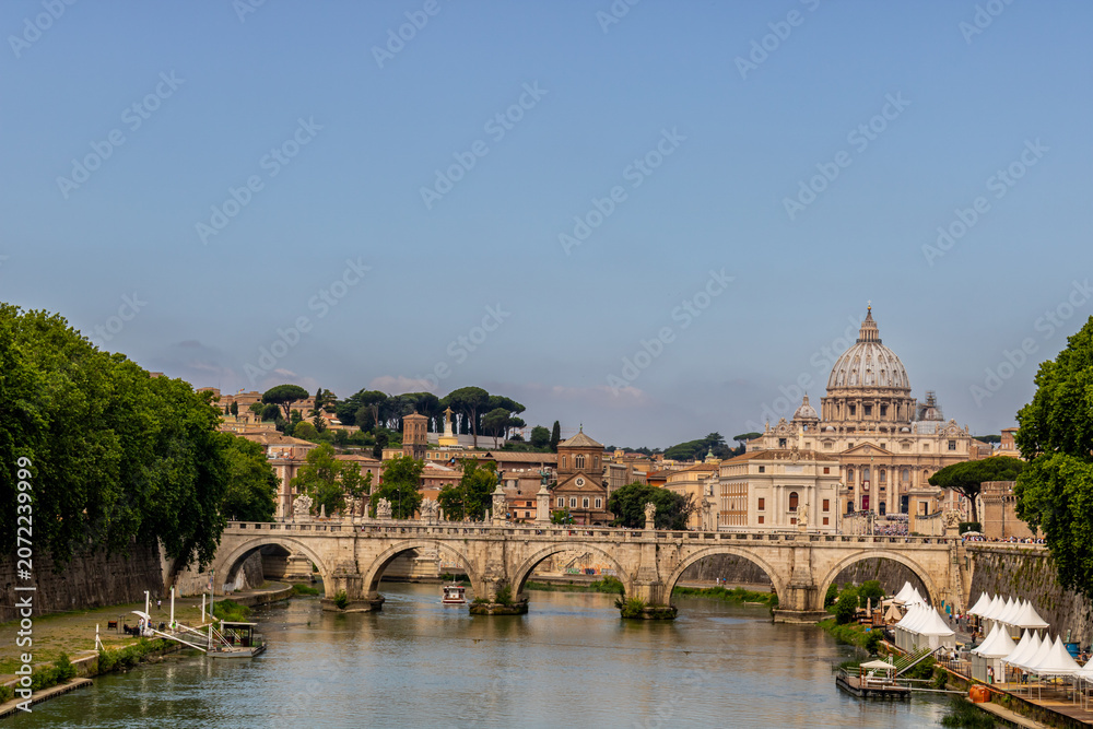 Fototapeta premium Famous tourist attraction and panoramic view of the Saint Peter`s basilica and the Vatican city architecture in Rome, Italy