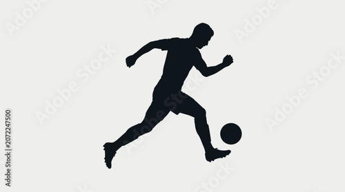 Dynamic silhouette of a male soccer player dribbling a football, capturing athletic action and movement in a sports game.