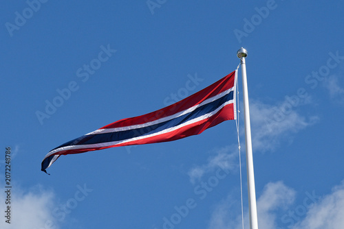 Norwegian Flag Proudly Waving Against a Vivid Blue Sky