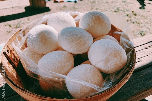 Steamed Buns in Bamboo Basket, Freshly Wrapped in Clear Plastic Wrap