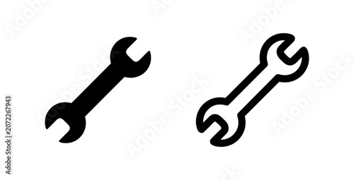 Fotografie Classic spanner or wrench icon in solid and outline styles, a fundamental tool for various mechanical tasks