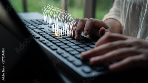 Canvas Print Person Typing on Keyboard with Digital Data Visualization Overlay in Modern Workspace Environment Quark