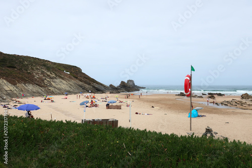 Portimão, Algarve, Portugal. Praia da Zambujeira do Mar is surrounded by high cliffs, from where you can enjoy a stunning panorama over the ocean.
