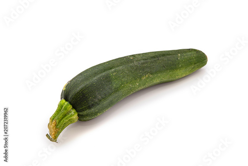 Long green zucchini placed on a plain white background with no other items present in the scene to distract view