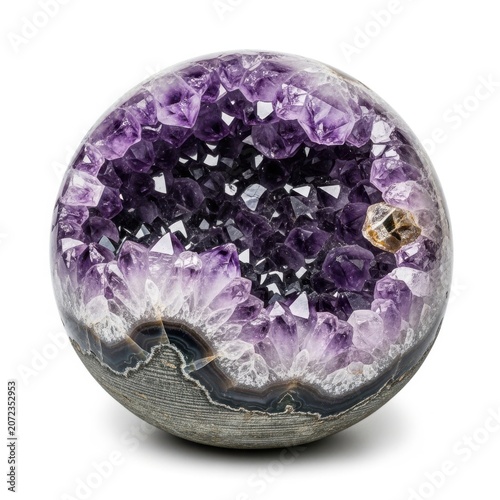 A perfectly spherical amethyst geode featuring deep purple crystals on white background
