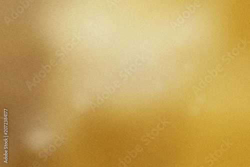 Bilde på lerret Warm champagne gold fills the frame with fine grain and a gentle light falloff, creating a luxurious surface backdrop for high-end branding and packaging