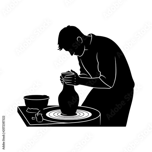 Silhouette of a potter shaping a ceramic vase on a wheel