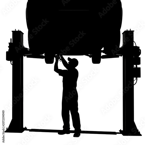 Auto mechanic repairing a vehicle on a hydraulic lift