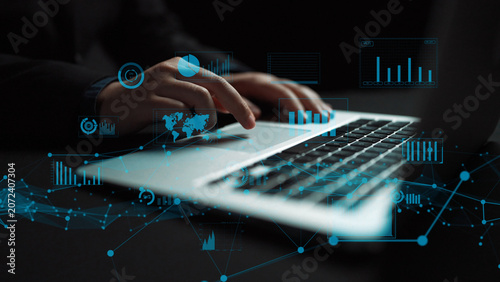 Konstfotografi Close-up of hands typing on a laptop, surrounded by digital data visuals and graphs that represent modern technology and business analytics in a creative workspace
