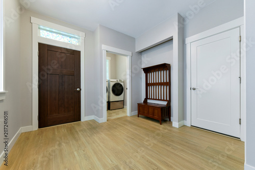Modern residential front entrance and laundry room interior