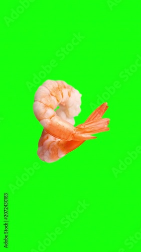 Cooked shrimp rotating on a green screen keying background