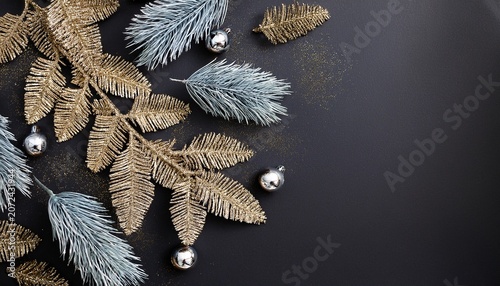 Magical Wintry Flatlay With Glossy Gold Frosted Evergreen Branches And Silver Glitter On Charcoal