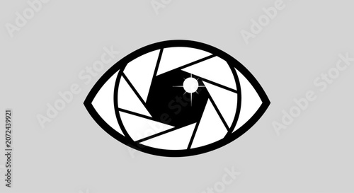 A stylized graphic icon of an eye featuring a camera lens aperture iris.