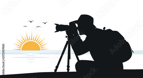 A silhouette of a photographer capturing a sunrise scene with a camera on a tripod.