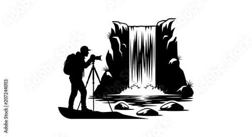 Silhouette of a photographer capturing a scenic waterfall landscape.