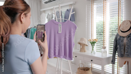 Bild auf Leinwand Young adult woman asia people take photo used shirt second hand sell