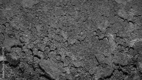 Black and white abstract grunge texture background, rough monochrome surface with dark weathered peeling details.