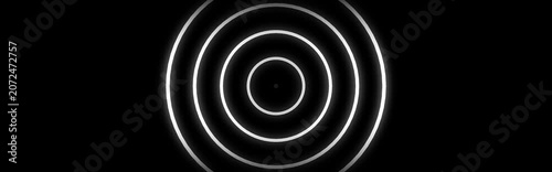 Glowing white concentric circles, neon light rings, black background, abstract motion graphics element, futuristic technology animation