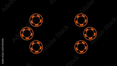 Abstract orange poker chips rotating clockwise on black background video.