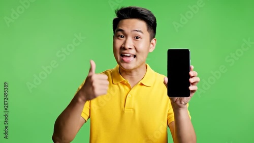 Excited man points at a blank smartphone screen