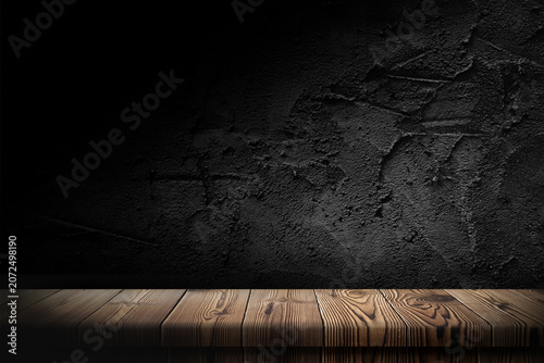 Obraz na plátně Wooden table in dark room background concept for advertising