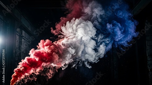 Colorful smoke cloud with red white blue hues against dark background