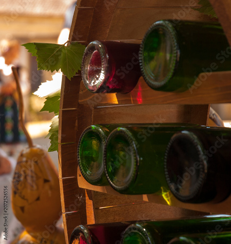 Wine Bottles Stored Horizontally in Rustic Wooden Rack