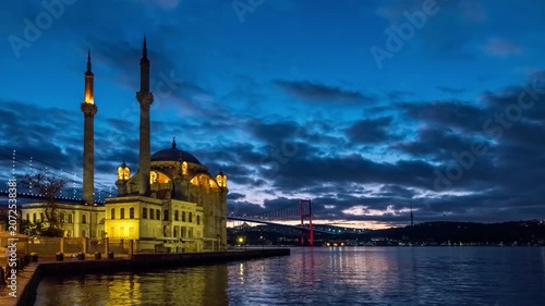 Istanbul Turkiye (Turkey) time lapse night city skyline at Buyuk Mecidiye Mosque and Bosphorus Bridge