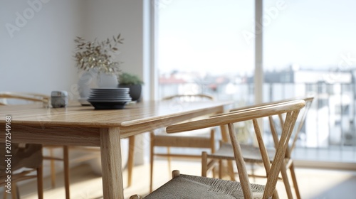 A bright dining room with a wooden table and chairs overlooks a cityscape.