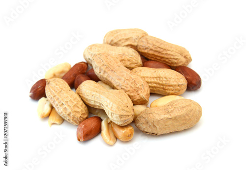 Dried peanuts in closeup on white