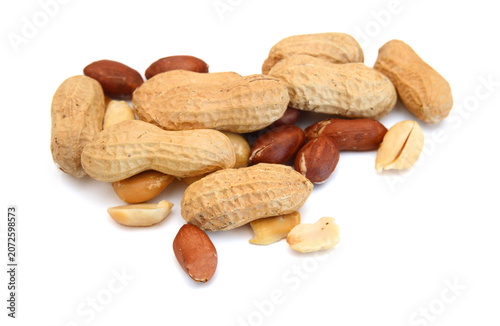 Dried peanuts in closeup on white