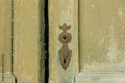 Wooden door with keyhole, ruins of 19th century building, Poland, Europe, summer.