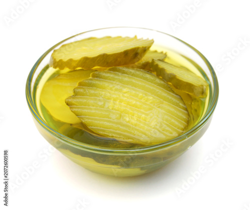 Fresh sliced green pickles isolated over white 