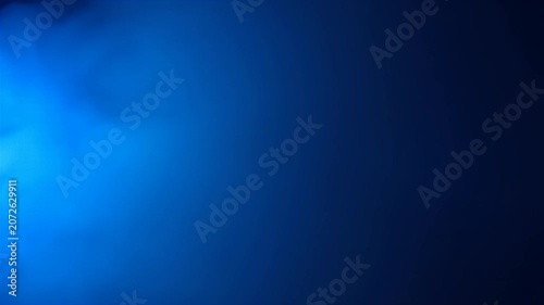 Abstract Blue Light Leak and Smoke Effect on Dark Background.