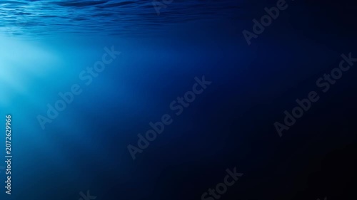 Underwater Ocean Scene with Sunlight Rays and Deep Blue Water.
