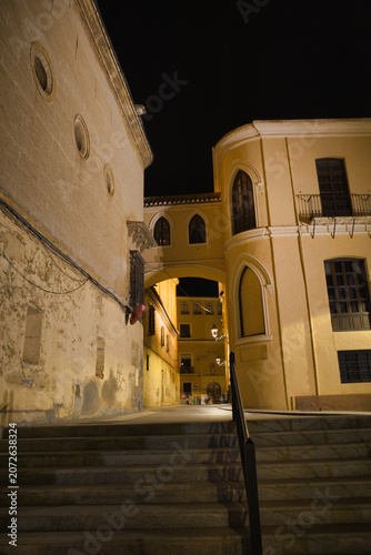 Foto Stone steps lead upward beneath warm night lights