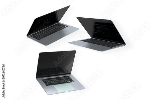 Assorted floating laptop and accessories isolated on white background, presenting concept of modern digital workspace