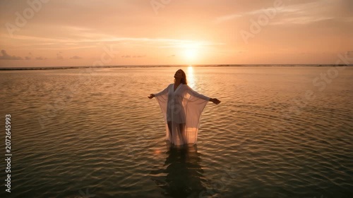 Woman at Golden Sunset on Spiritual Seaside Beach. 4K Video