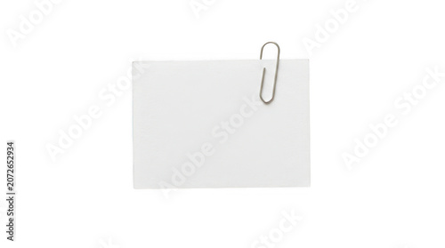 Blank white paper note with a metal paper clip isolated on transparent background