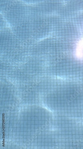 Abstract vertical background of water in the pool