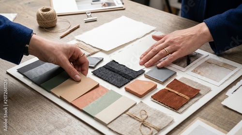 Art Direction Hands Refining Material Moodboard With Flash Lit Studio Table