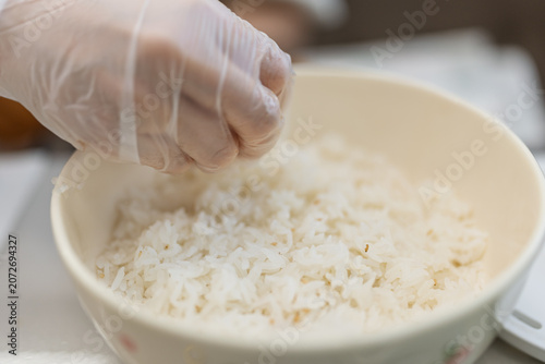 Принти на полотні Making glutinous rice food while wearing gloves