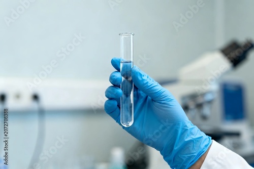 Scientist Holding Test Tube in Lab