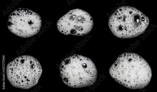 Fotografie Set of six realistic white soap foam bubbles with detailed lather texture isolated on black background, cleansing and hygiene collection for shampoo, detergent, skincare, and cleaning design