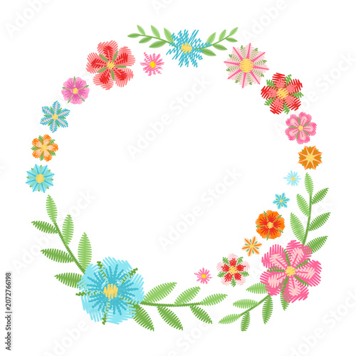 Embroidered floral round frame with cute colorful flowers. Beautiful wreath isolated on white background. Vector design.