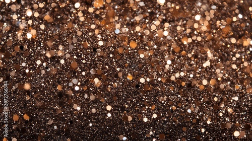 Abstract bokeh background with bronze and brown glitter.